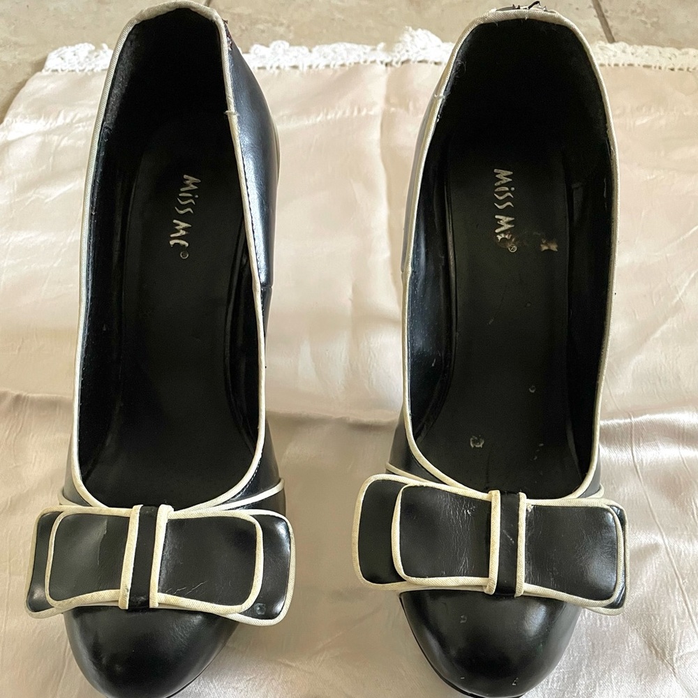 Miss Me Brand, has some scratches on it but can be cleaned up with shoe polish!